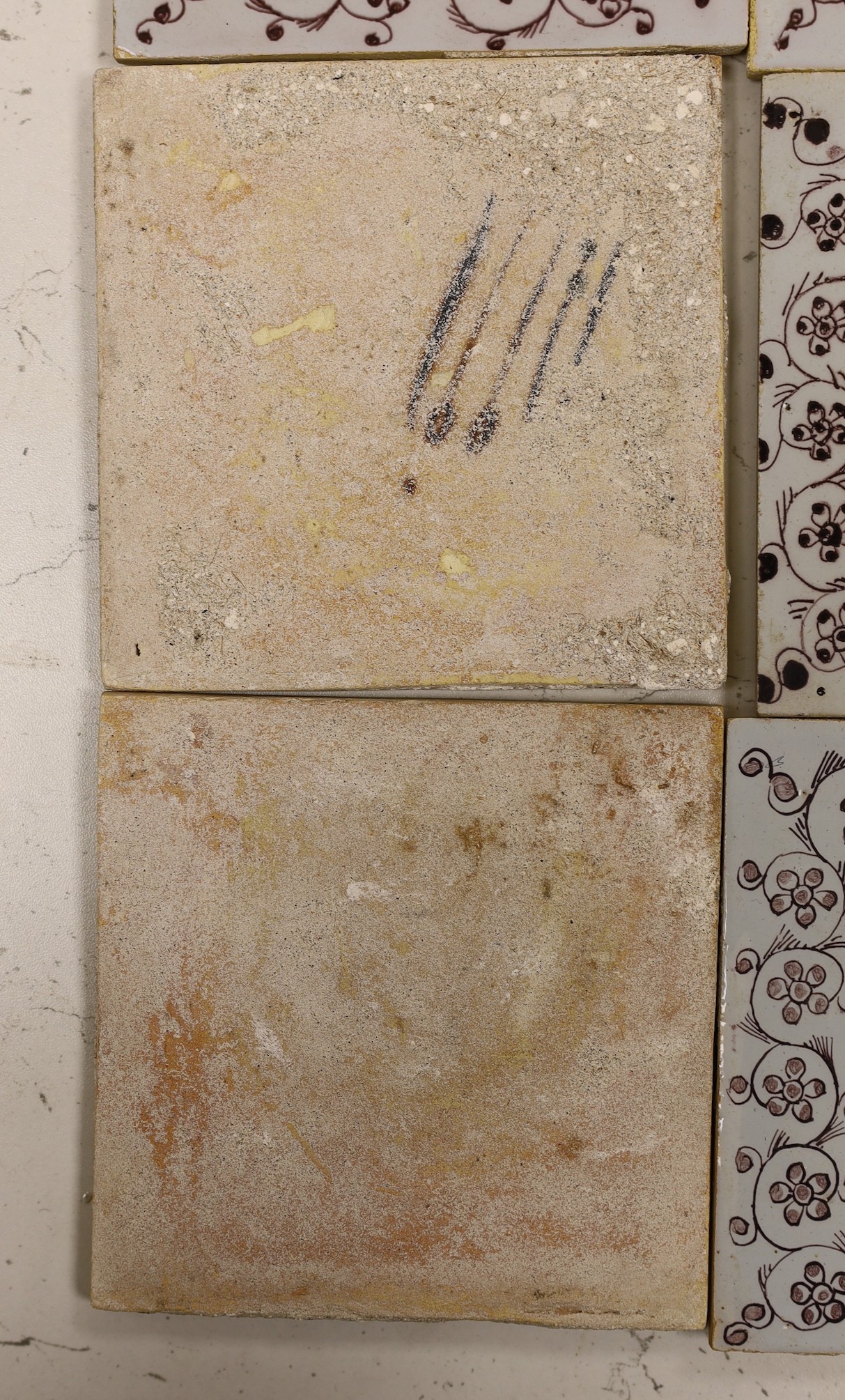 Six 18th/19th century Delft manganese flower spray tiles and two similar blue and white tiles, 18th century (8)